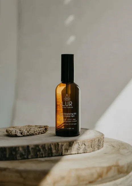 LUR cleansing oil bottle on wooden surface with natural light, skincare and wellness product